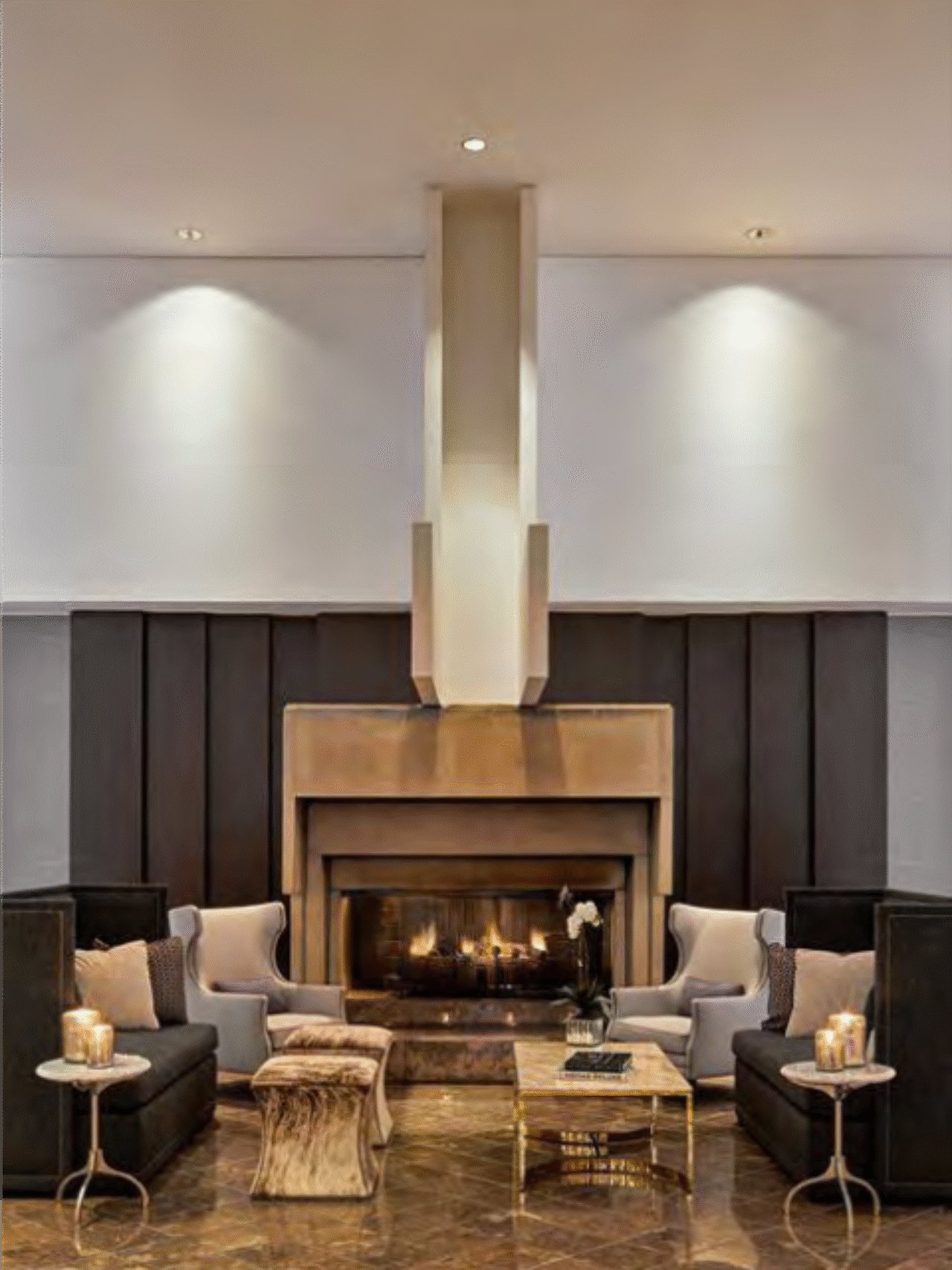 foyer with seating area in front of a fireplace